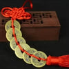 Handmade red knot feng shui coins for prosperity tied together on a string