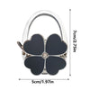 Silver foldable handbag hook with a black flower design and a clear jewel detail