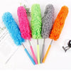 A set of four colorful telescopic electrostatic microfiber dusters with extendable stainless steel handles.
