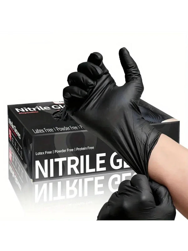 A hand wearing a black disposable nitrile cleaning glove is shown holding up the glove for display.