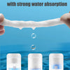 A hand holds a white cotton towel, illustrating the process of water absorption for disposable face towels.