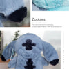 A light blue cartoon anime plush toy with black accents.