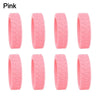 Eight pink silicone luggage wheel protectors for protection and grip.