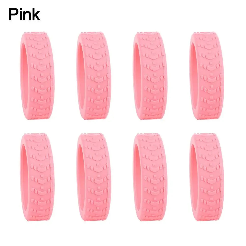 Eight pink silicone luggage wheel protectors for protection and grip.