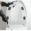 A person wearing black rubber cleaning gloves is operating a white reusable rubber cleaning glove machine.