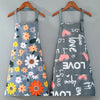 Gray apron with a floral print featuring pink and orange hearts and daisies.