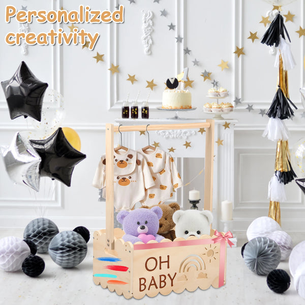 A wooden storage basket with a handle is displayed in a decorated setting, featuring baby-themed items and stars.