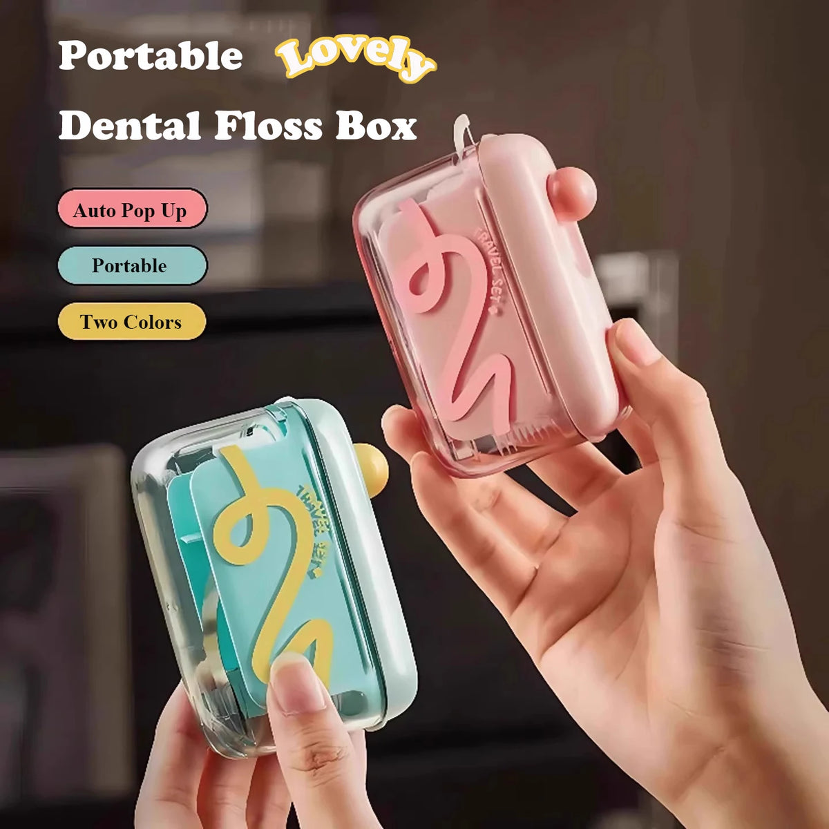 Eine Hand hält eine rosa faltbare Zahnseidebox mit wirbelndem Design und eine türkisblaue Version.