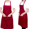 A deep red oil-proof cooking apron worn over a white shirt, featuring pockets.