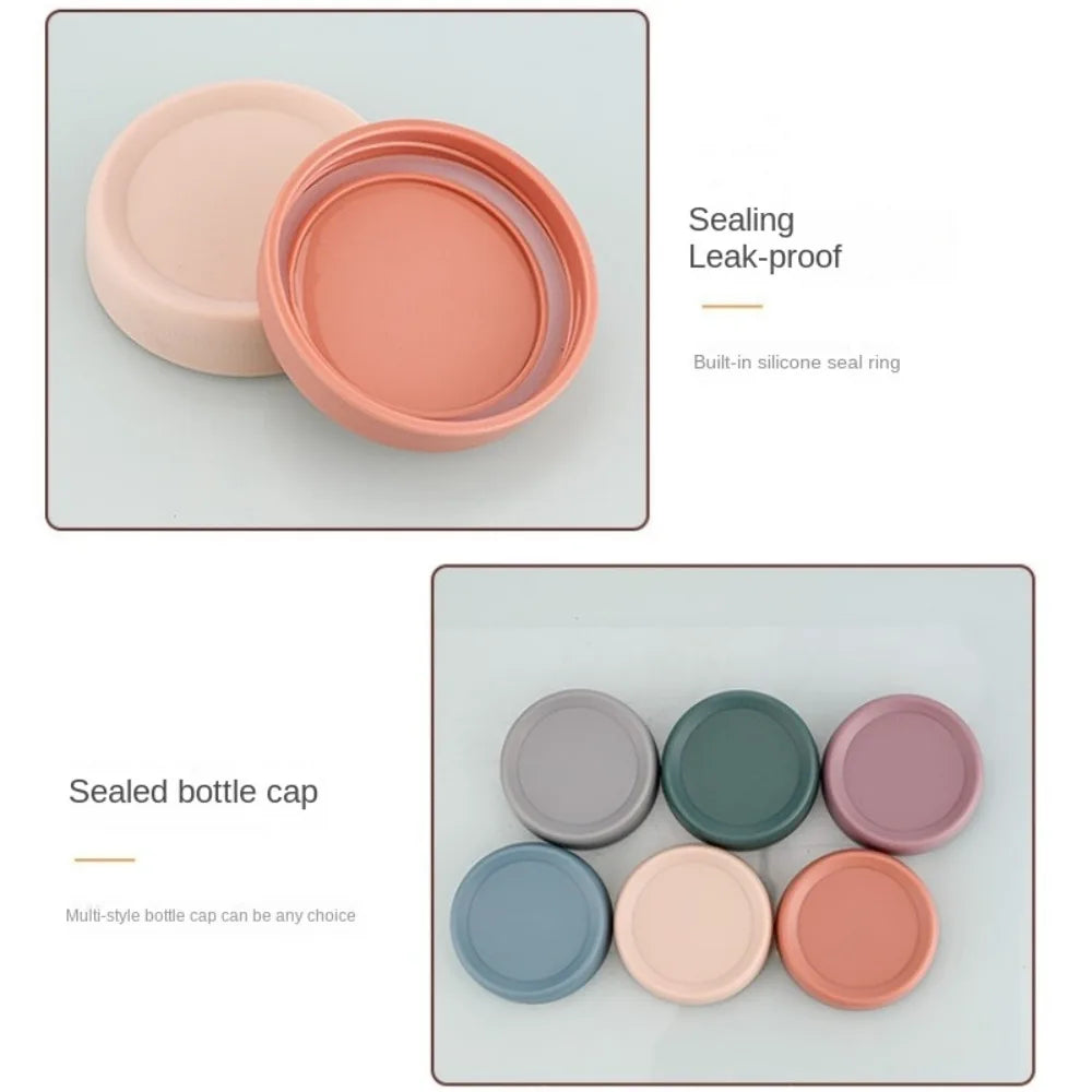 A set of pink and green glass meal prep jars with silicone sealing rings for airtight lids.