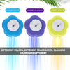 Three disposable toilet cleaning foam sponges in ocean blue, lavender, and lemon colors are shown with flowing water.