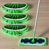 Three reusable microfiber mop pads in bright green with white trim and a long handle.