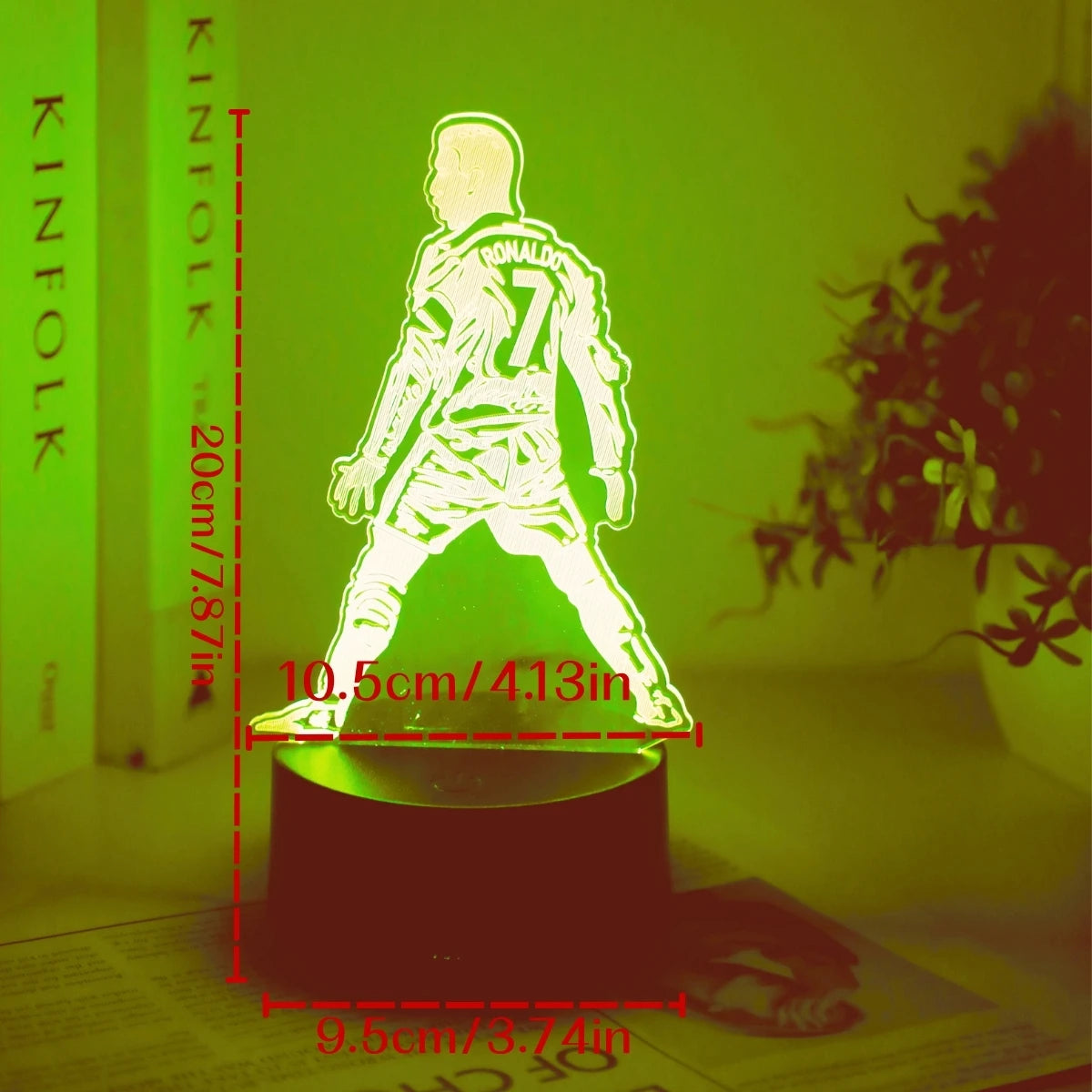 A glowing 3D touch night light shaped like a soccer player, illuminated in a vibrant green color.