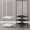 A multi-layer corner coat rack with white and black metal framing and shelves.