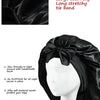 Black satin sleep bonnet with a large tie band shown on a mannequin head.