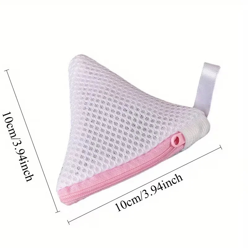 A pink reusable mesh laundry bag with a white strap, shown from the side.