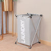 A gray foldable waterproof laundry basket with a metal frame is shown standing on a light-colored rug.