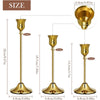 Set of six gold weighted metal taper candlestick holders shown in various sizes and angles.