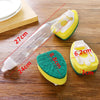 A dish wand cleaning brush set featuring a clear plastic handle and a yellow sponge with green bristles.