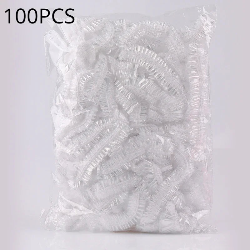 A bag containing 100 pieces of reusable transparent shower caps.