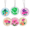 Set of five eco-friendly wood pulp sponges shaped like various leaves and flowers for kitchen cleaning