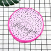 Pink reusable fruit shower cap with a black speckled pattern and the word Pitaya written on it.
