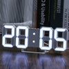 A white digital alarm clock displaying 28:06 on a wooden surface.