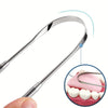 A stainless steel tongue scraper is shown being used to clean teeth and tongue.