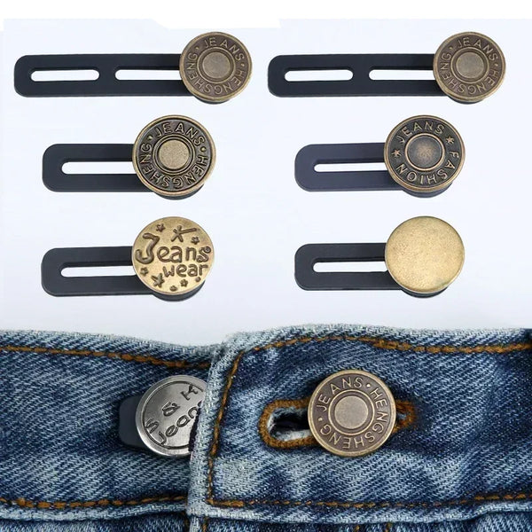 A set of adjustable button extenders in gold and brass colors shown against a denim fabric.