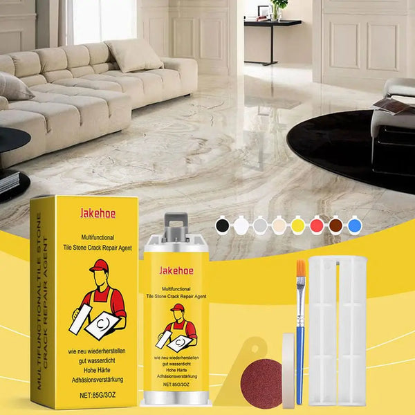 A yellow box and a silver spray bottle of Jakehoe Tile Stone Crack Repair Agent are shown on a marble floor.