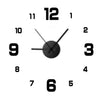 A black analog wall clock face showing the time as 12:00.