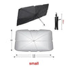 A black car sunshade umbrella with a handle and a silver reflective surface.