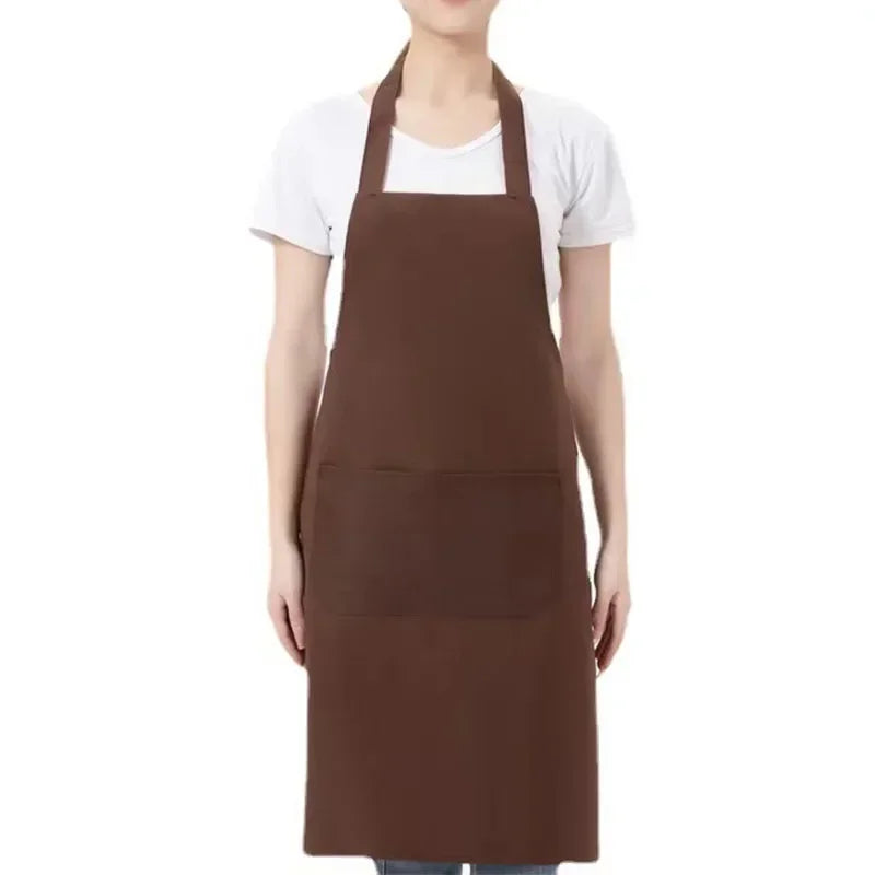 A brown adjustable unisex cooking apron worn by a person.
