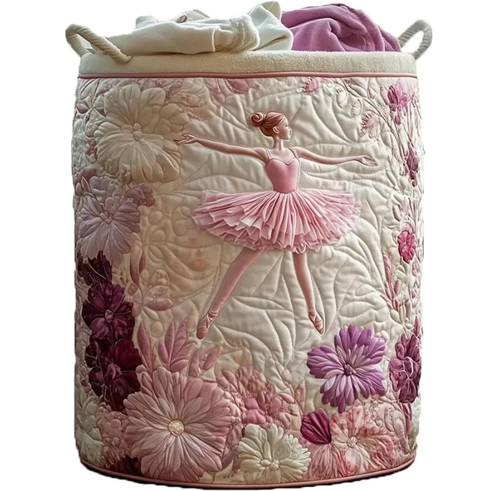 A quilted laundry basket in pink and white floral pattern with purple fabric lining and handles.