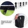 A set of metal zippers and sliders for repairing pant bags and suitcases shown next to a piece of fabric.