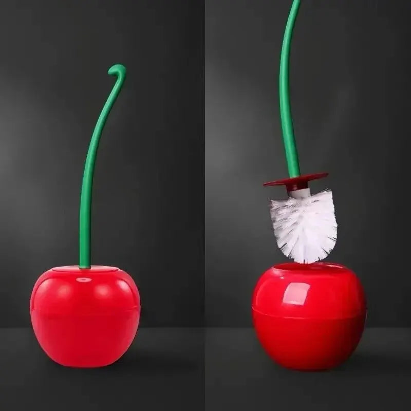 A red decorative cherry-shaped toilet brush with a green handle and bristles.