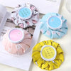 Reusable therapy pack featuring various colored fabric wraps for ice and hot water treatments