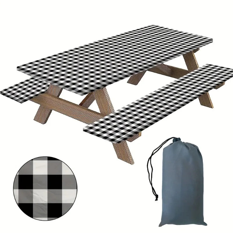 A plaid tablecloth set featuring a black and white checkered pattern with wooden supports and a gray fabric bag.