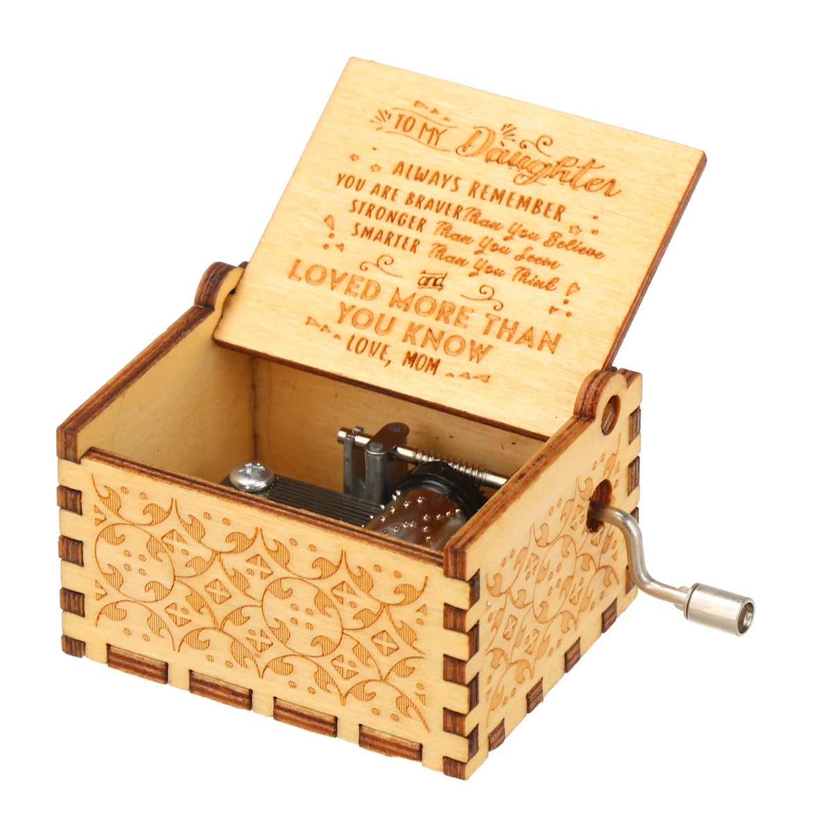 A vintage engraved wooden music box with a lid open showing an inscription for a daughter