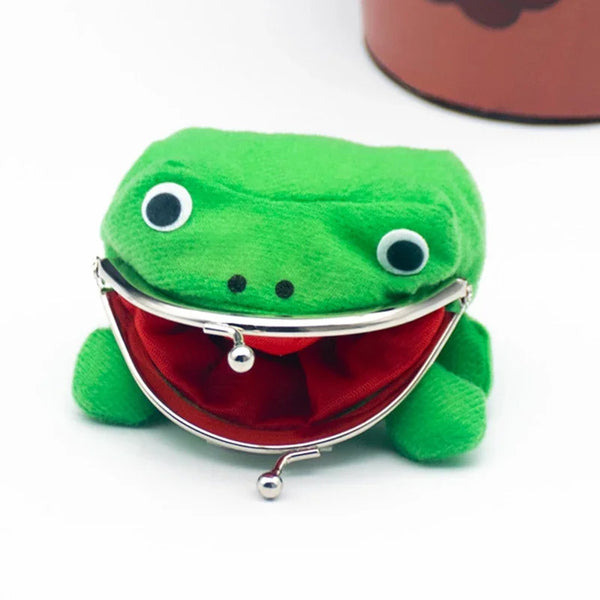 A bright green frog plush toy shaped like a wallet with a red lining and silver clasp.
