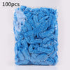 A clear plastic bag filled with 100 blue reusable transparent shower caps.