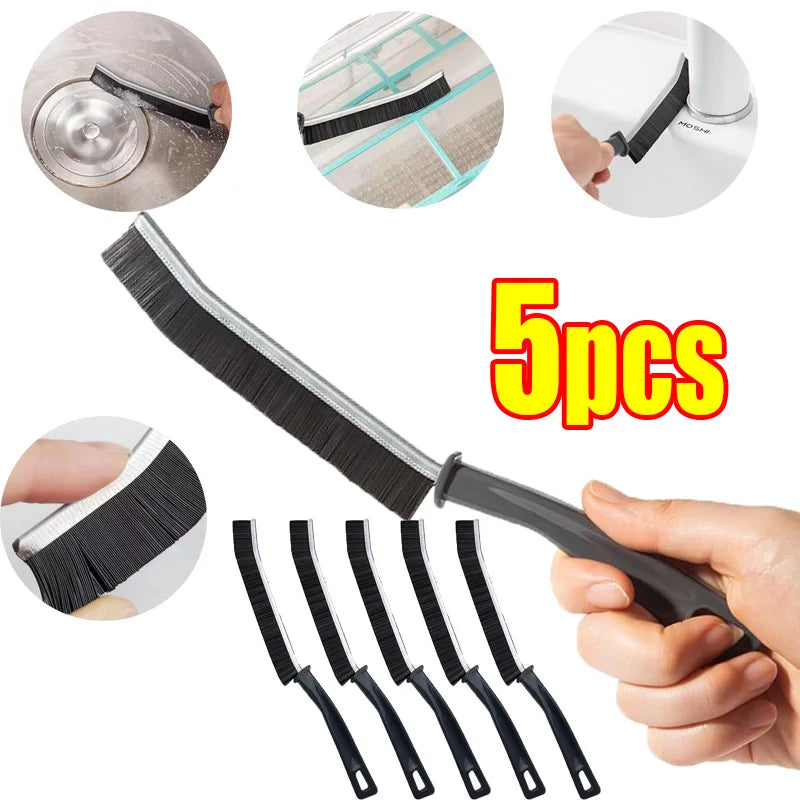 A set of five black hard bristle crevice cleaning brushes and a cleaning brush are shown for detailed cleaning.