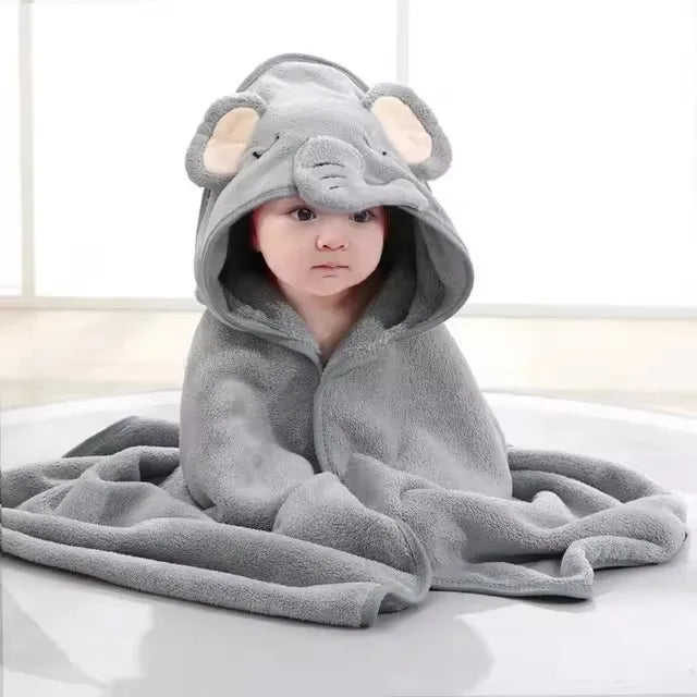 Baby in gray elephant hooded towel and swaddle set
