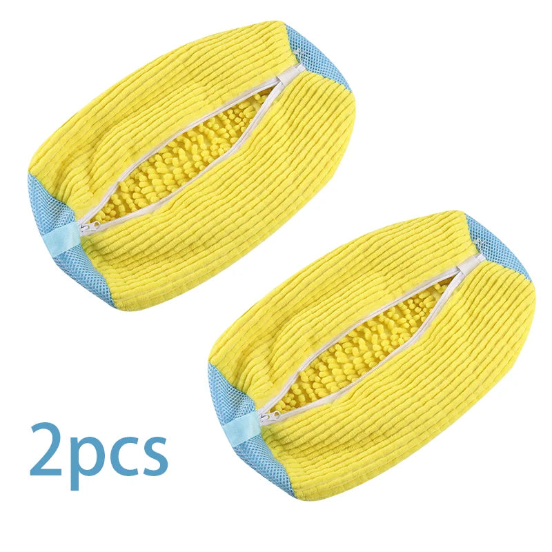 Two yellow reusable shoe washing bags with an invisible zipper and blue trim.