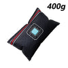 A black reusable silica gel dehumidifier bag with pink and blue accents.