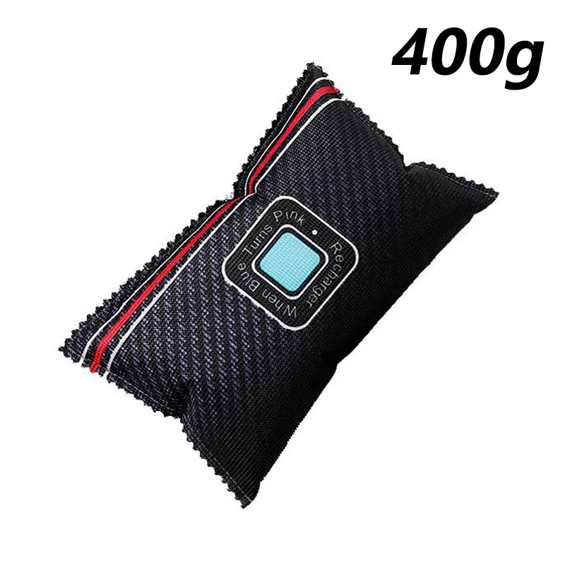 A black reusable silica gel dehumidifier bag with pink and blue accents.