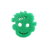 A bright green, textured sponge shaped like a smiling face with lightning bolt details.