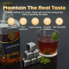 A bottle of Jagadal Whisky next to reusable stainless steel whiskey ice cubes and a glass of whiskey.