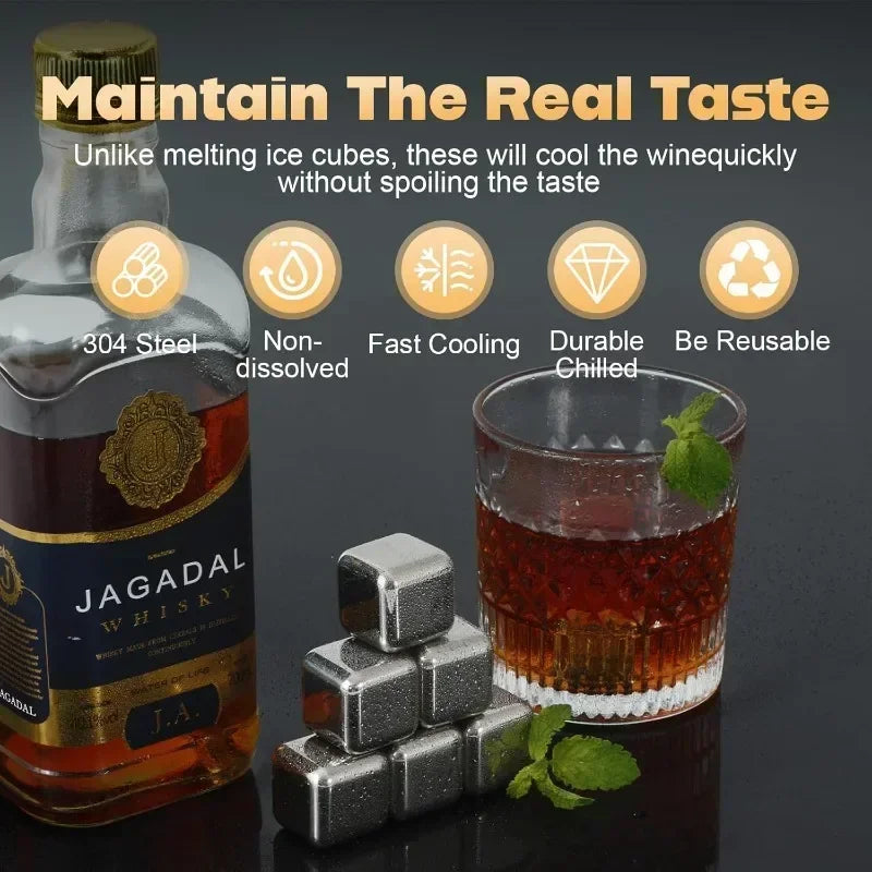 A bottle of Jagadal Whisky next to reusable stainless steel whiskey ice cubes and a glass of whiskey.