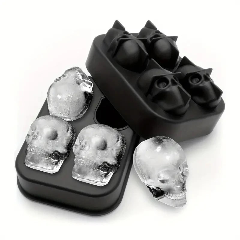 Black silicone ice cube mold with a lid and several skull-shaped ice cubes.